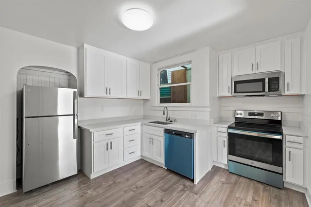 a kitchen with a stove and a sink