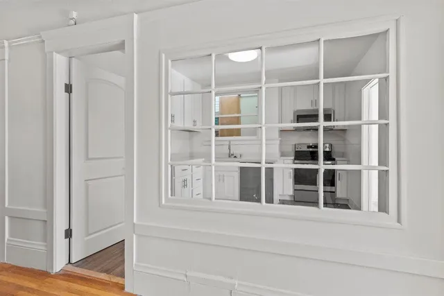 a balcony with furniture and a potted plant