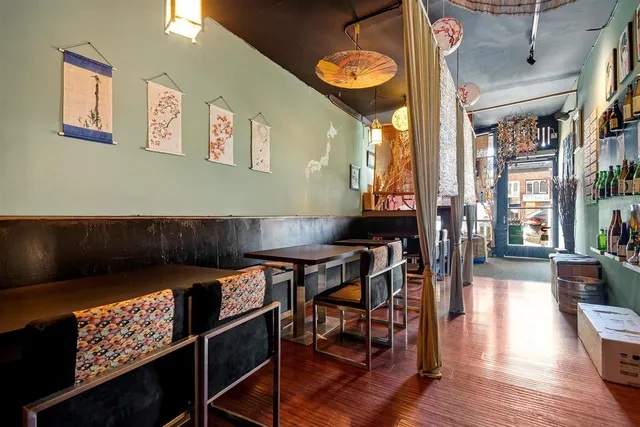 a view of a dining room with furniture and chandelier