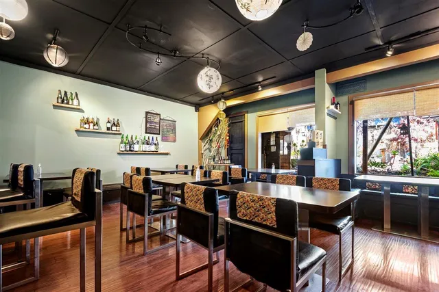 a view of a dining area with furniture and chandelier