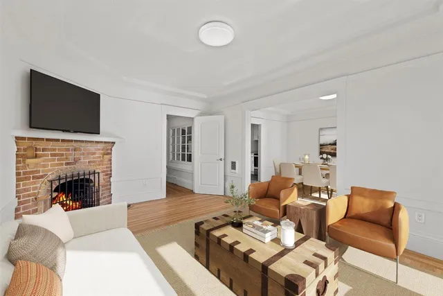 a view of a dining room with furniture large windows and wooden floor