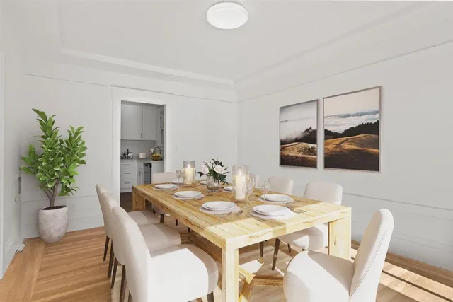 a dining room with furniture a rug and a fireplace