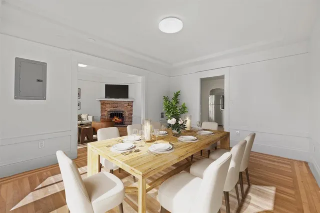 a kitchen with a white cabinets and window