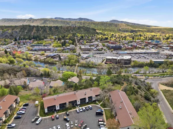 an aerial view of residential houses and outdoor space