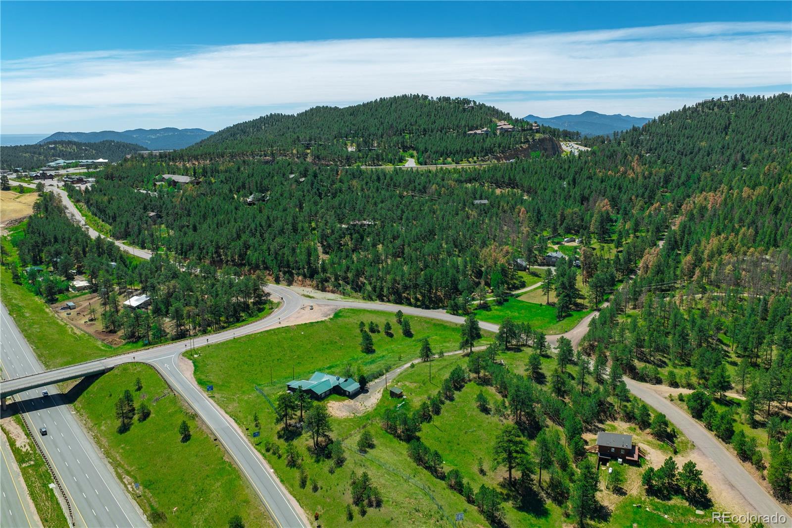 29793 Ruby Ranch Road Evergreen, CO 80439 - Photo 21 of 28 a view of a city with lush green forest