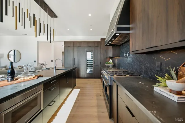 a large hall with a double vanity sink and a mirror