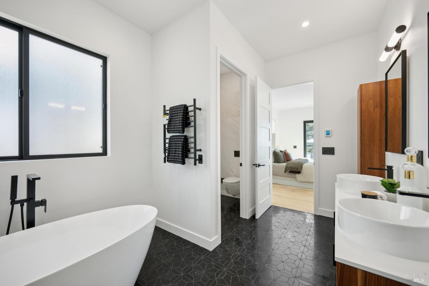 2156 Wedgewood Way Santa Rosa, CA 95404 - Photo 33 of 67 The primary suite features beautiful marble heated flooring, heated towel racks and a separate room for the Duravit toilet.