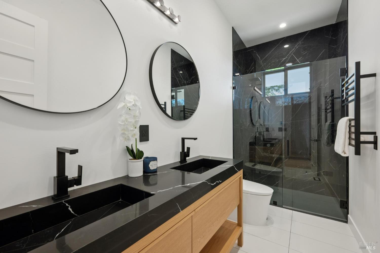 2156 Wedgewood Way Santa Rosa, CA 95404 - Photo 65 of 70 Serving the fourth bedroom and family room, this free-standing bathroom offers a walk-in shower, heated towel rack and floor.