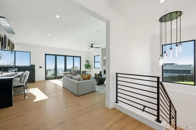 a bedroom with a large bed and a large window