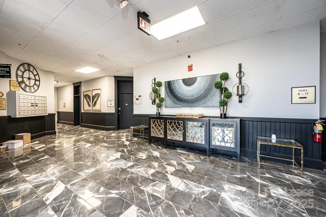 a living room with furniture a dining table and window