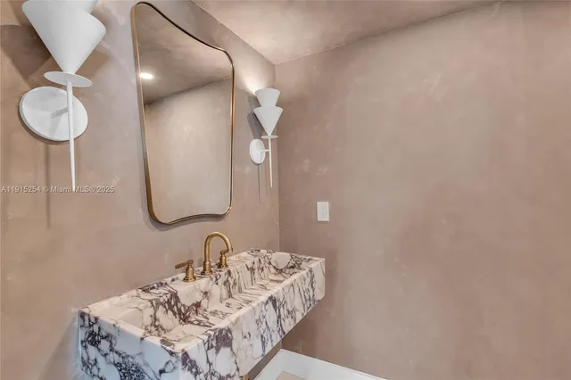 a bathroom with a bathtub and a sink