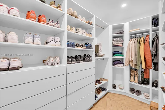 a bathroom with a double vanity sink mirror and bathtub