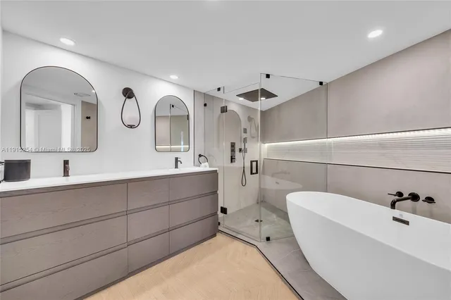 a white bath tub sitting in a bathroom