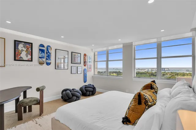 a bathroom with a sink mirror vanity and toilet