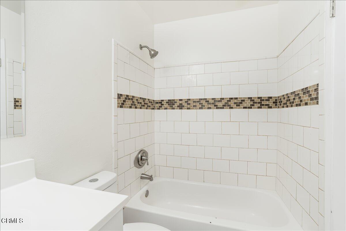 5147 Perkins Road Oxnard, CA 93033 - Photo 23 of 42 a bathroom with a bathtub and shower