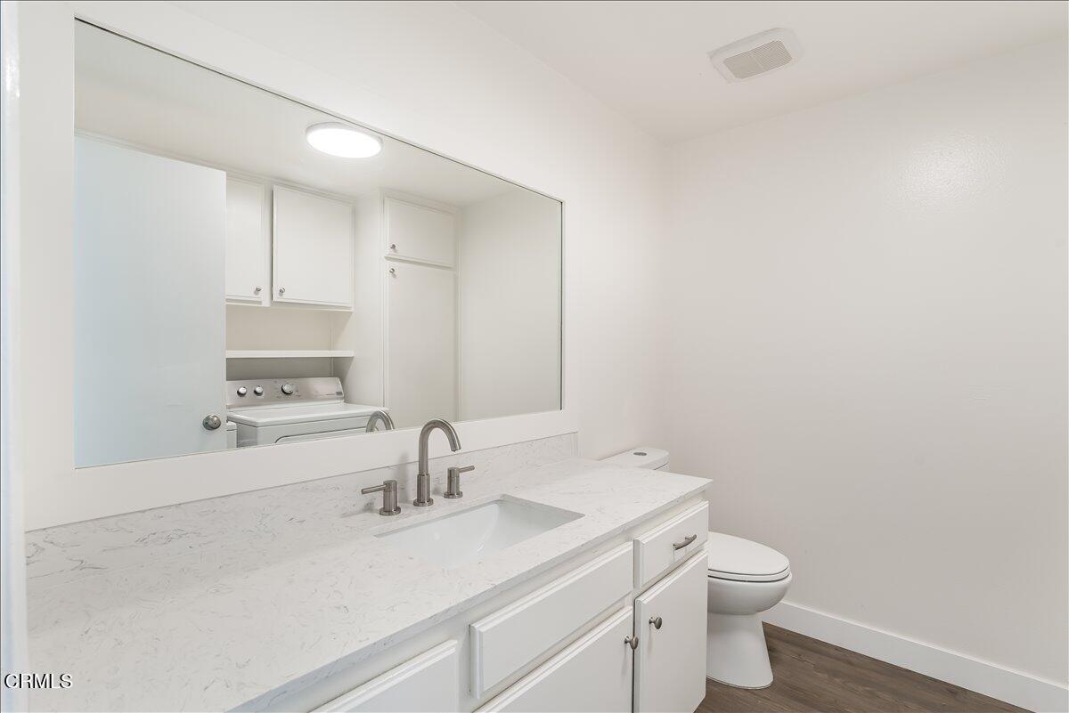 5147 Perkins Road Oxnard, CA 93033 - Photo 9 of 42 a bathroom with a sink a toilet and a mirror