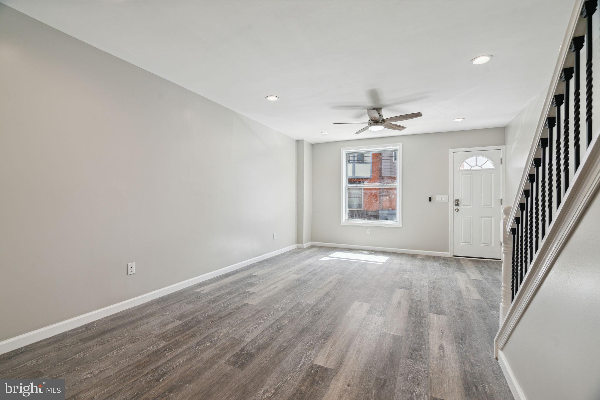 2033 Emily Street Philadelphia, PA 19145 - Photo 11 of 42 wooden floor in an empty room with a window