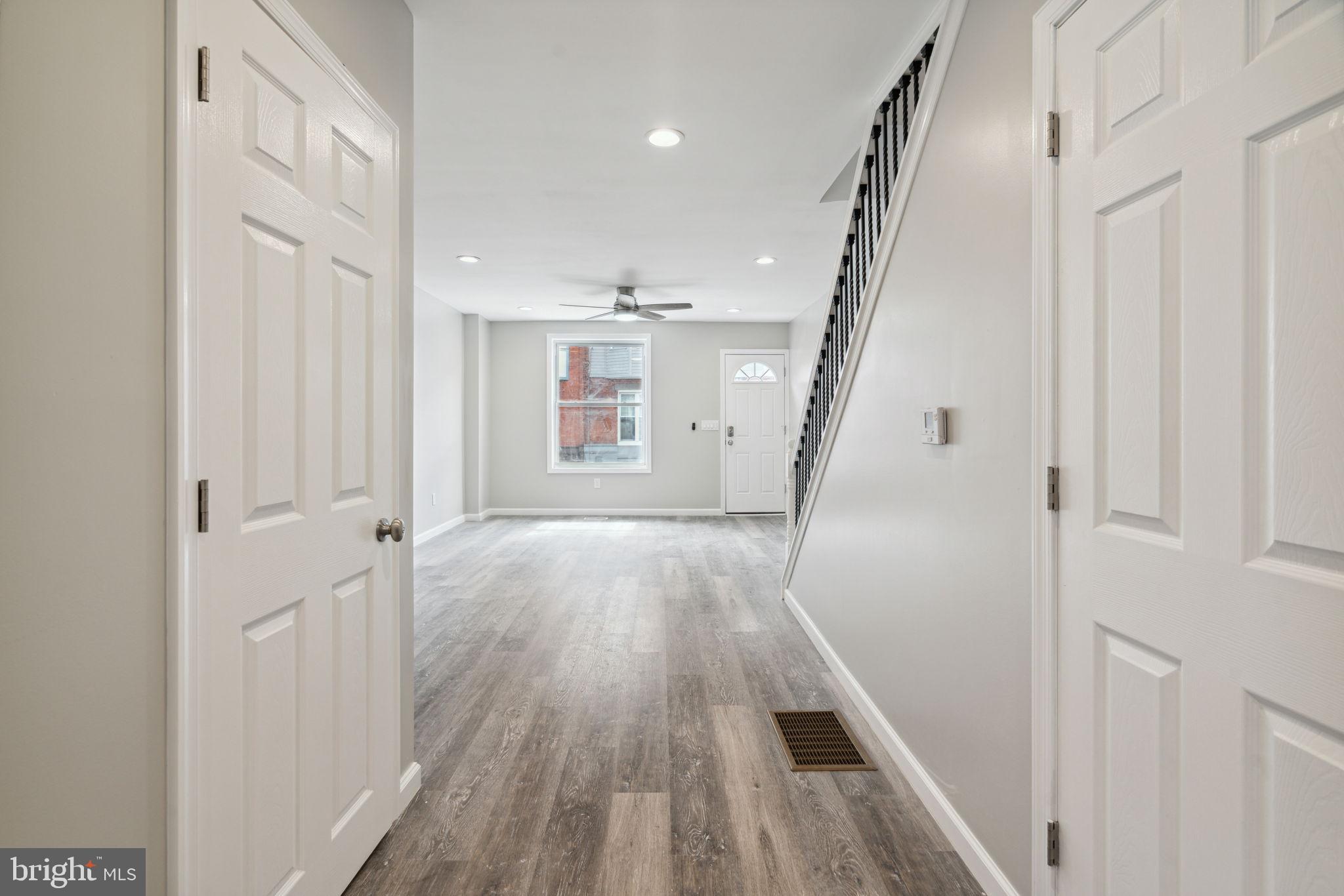 2033 Emily Street Philadelphia, PA 19145 - Photo 12 of 42 a view of a hallway with wooden floor and staircase