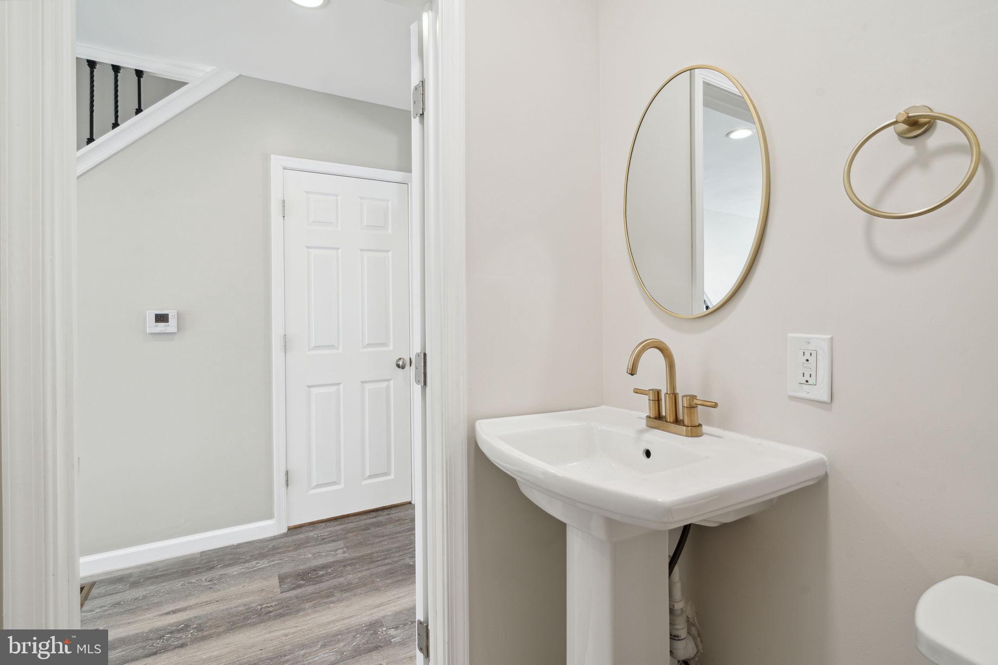 2033 Emily Street Philadelphia, PA 19145 - Photo 14 of 42 a bathroom with a sink and a mirror