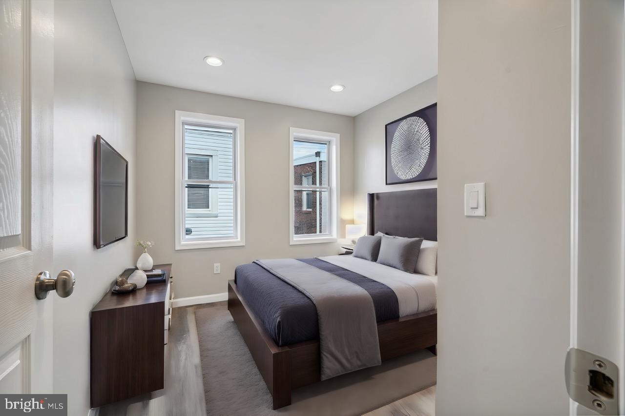 2033 Emily Street Philadelphia, PA 19145 - Photo 15 of 42 a bedroom with a bed and tv