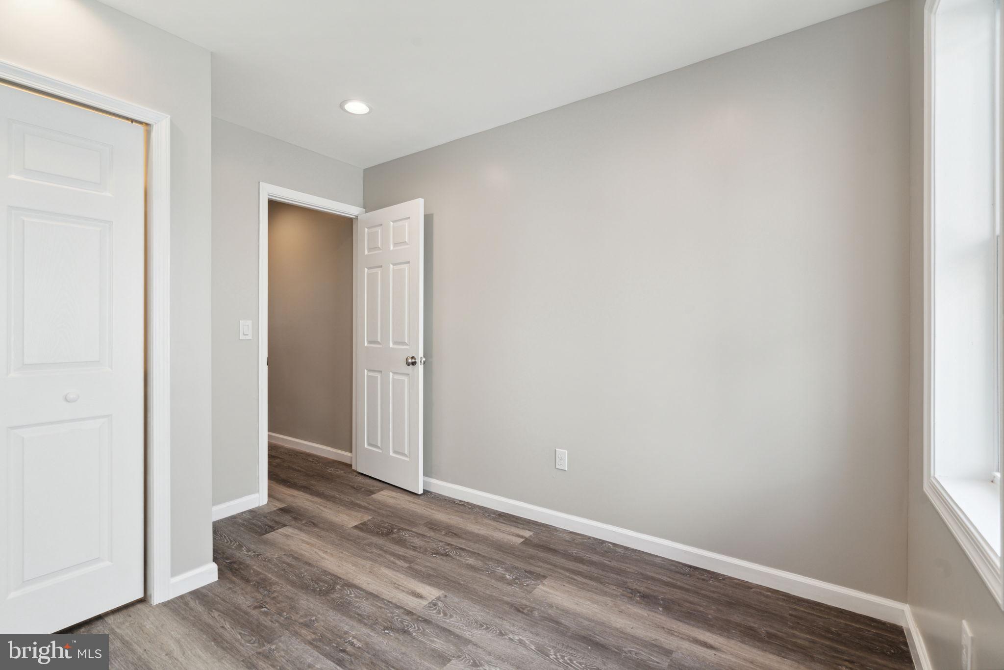 2033 Emily Street Philadelphia, PA 19145 - Photo 17 of 42 a view of an empty room with wooden floor