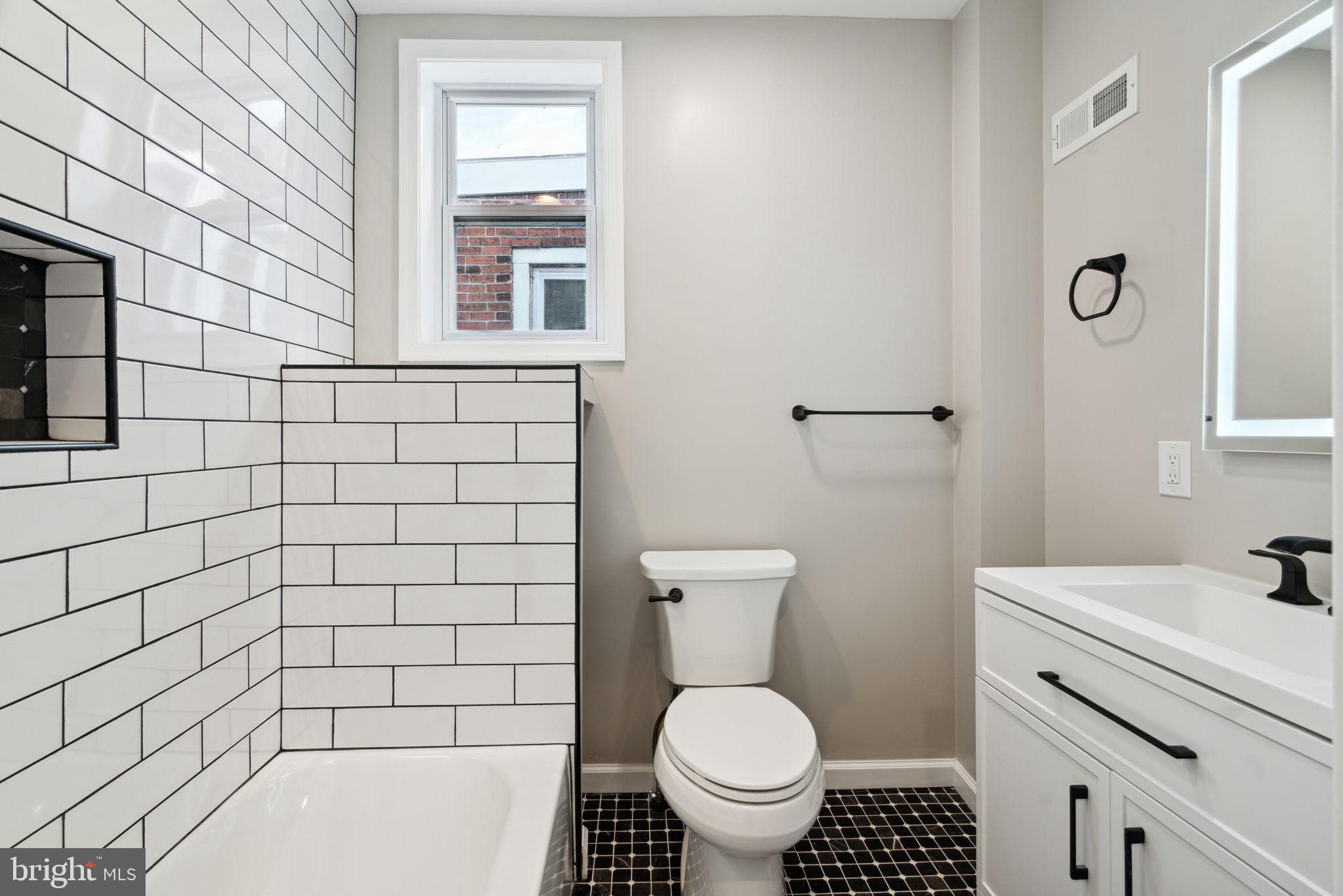 2033 Emily Street Philadelphia, PA 19145 - Photo 19 of 42 a bathroom with a sink toilet and shower