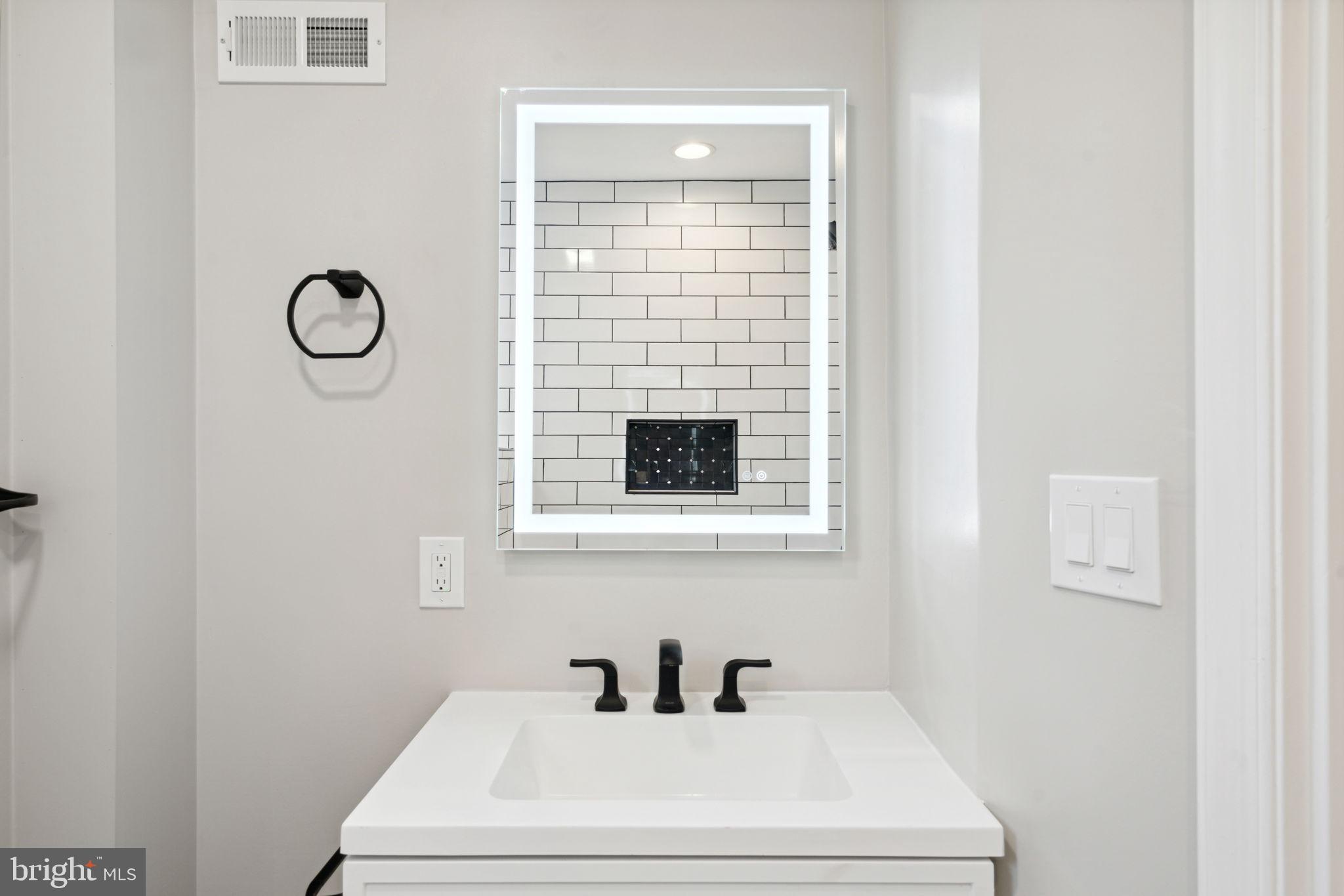 2033 Emily Street Philadelphia, PA 19145 - Photo 20 of 42 a bathroom with a toilet and a sink