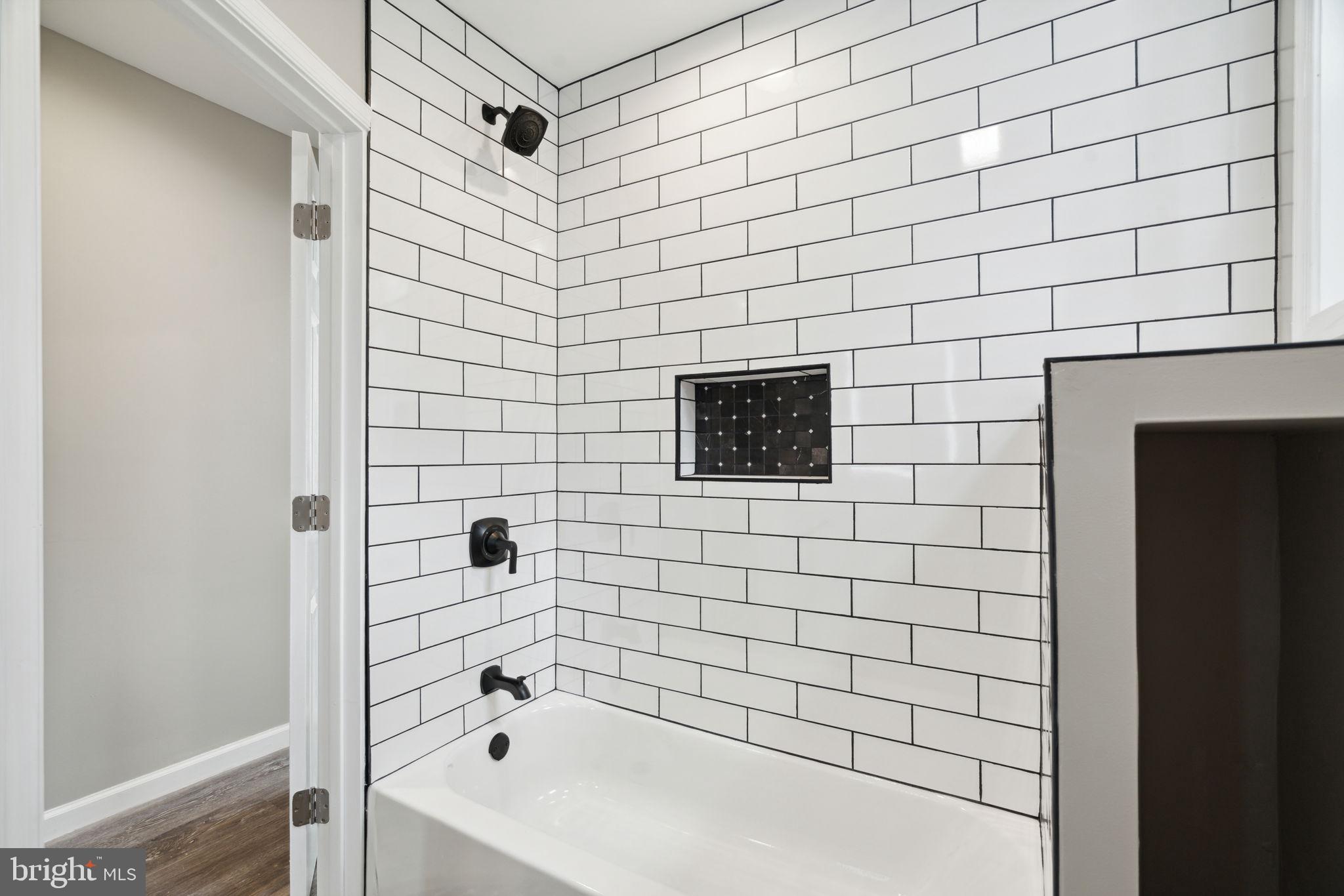 2033 Emily Street Philadelphia, PA 19145 - Photo 21 of 42 a bathroom with a bathtub and shower