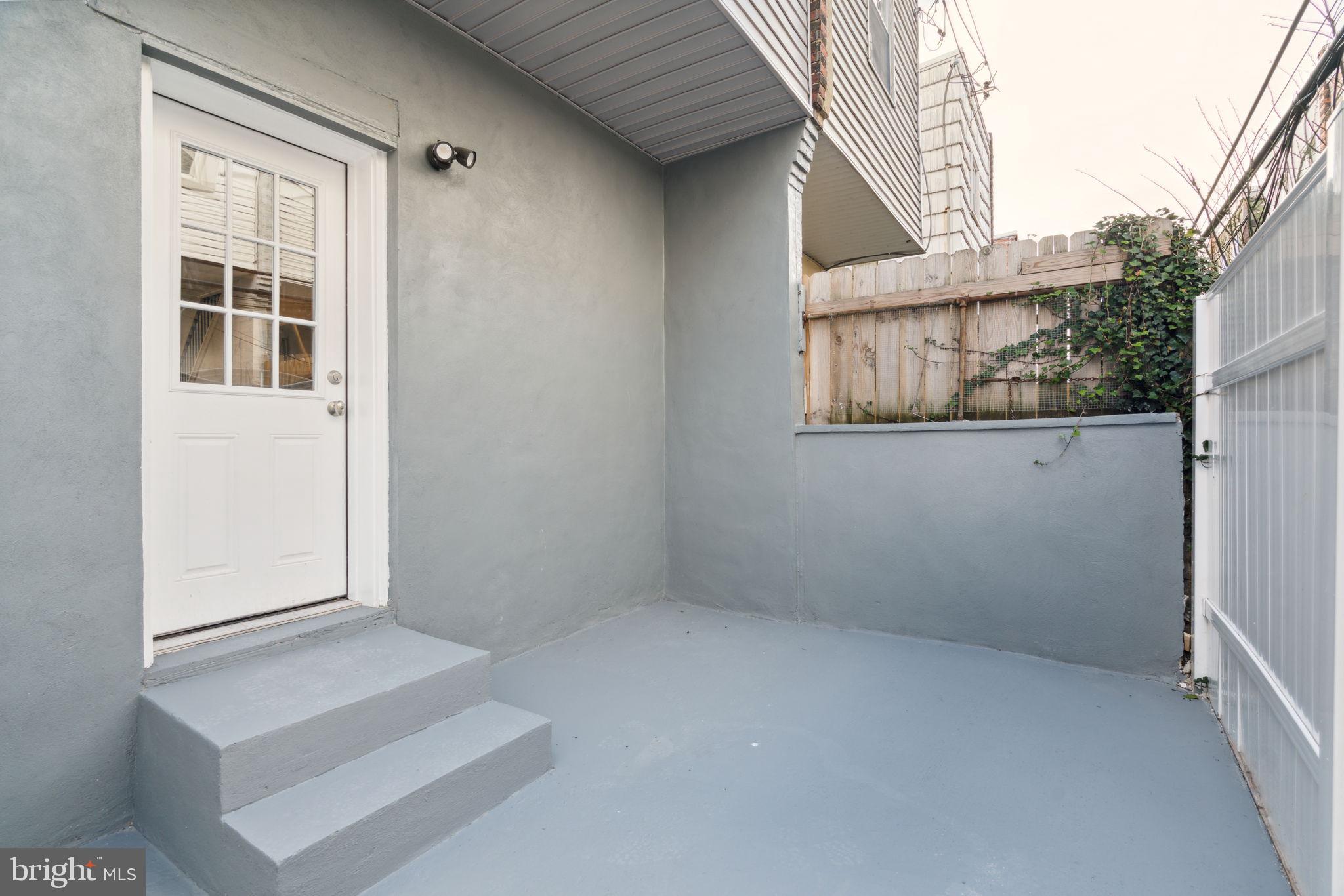 2033 Emily Street Philadelphia, PA 19145 - Photo 38 of 42 an empty room with windows