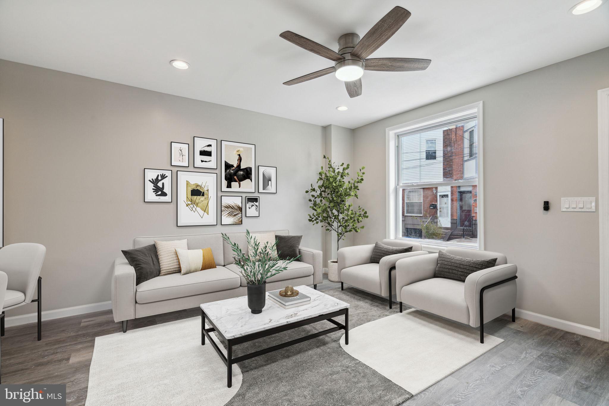 2033 Emily Street Philadelphia, PA 19145 - Photo 6 of 42 a living room with furniture and a large window