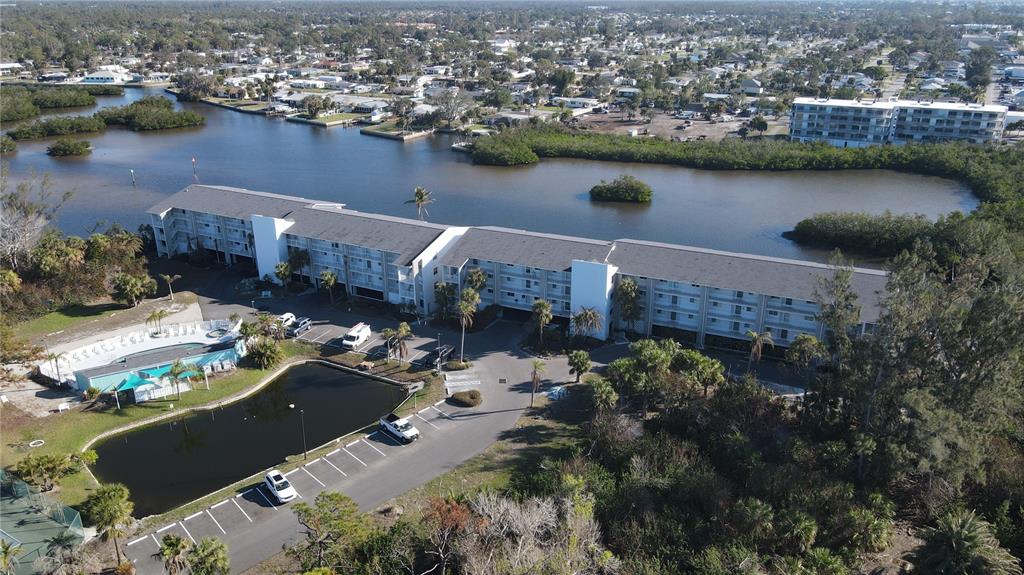 1401 South McCall Road, Unit B306 Englewood, FL 34223 - Photo 17 of 25 an aerial view of a house with a lake view