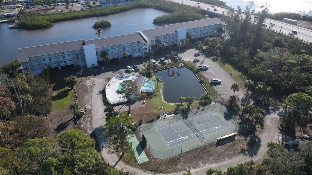 1401 South McCall Road, Unit B306 Englewood, FL 34223 - Photo 20 of 25 an aerial view of a house with outdoor space