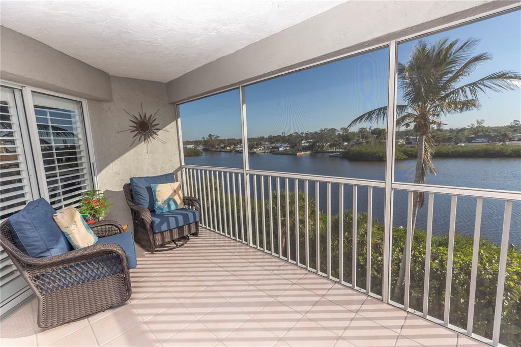1401 South McCall Road, Unit B306 Englewood, FL 34223 - Photo 4 of 25 a balcony with furniture and lamp