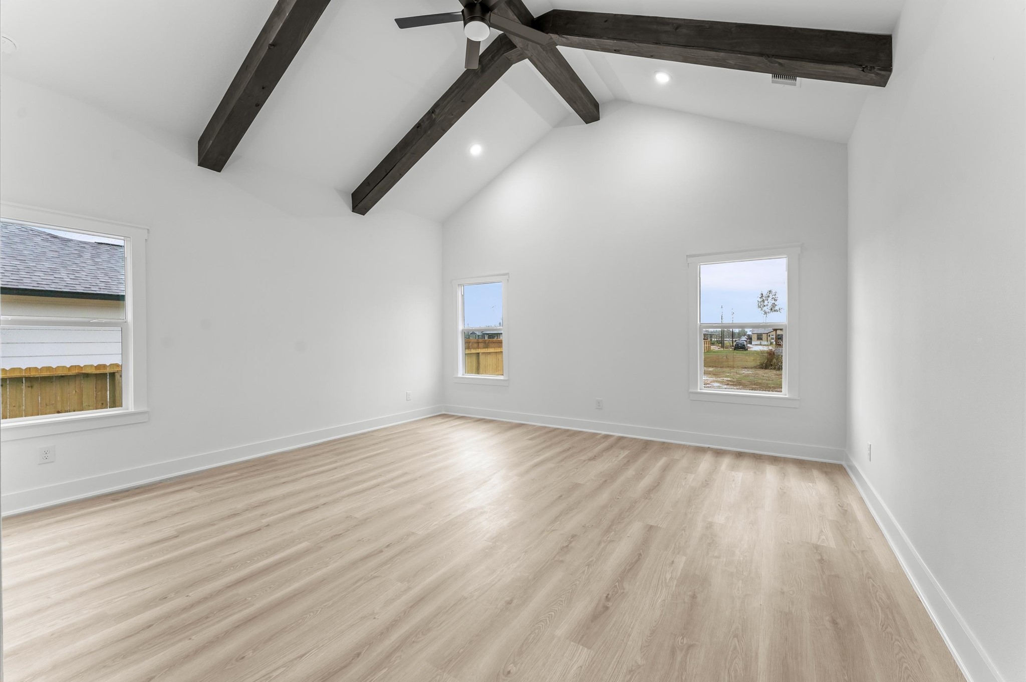 1133 Longleaf Pne Street Huffman, TX 77336 - Photo 16 of 25 Extra-large primary suite with high ceilings and plenty of natural light.