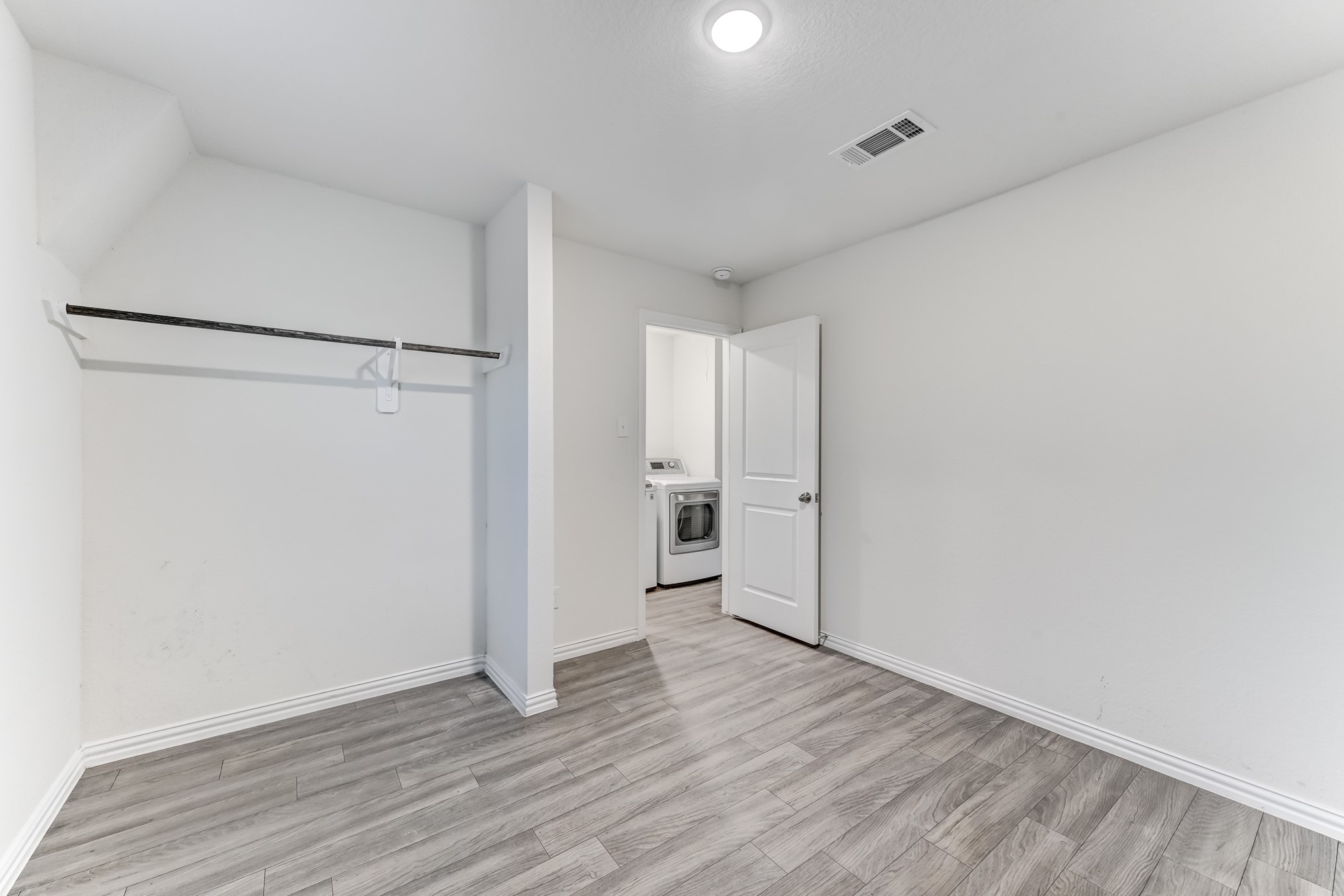 7925 Way Street, Unit A Houston, TX 77028 - Photo 24 of 29 a view of empty room with wooden floor