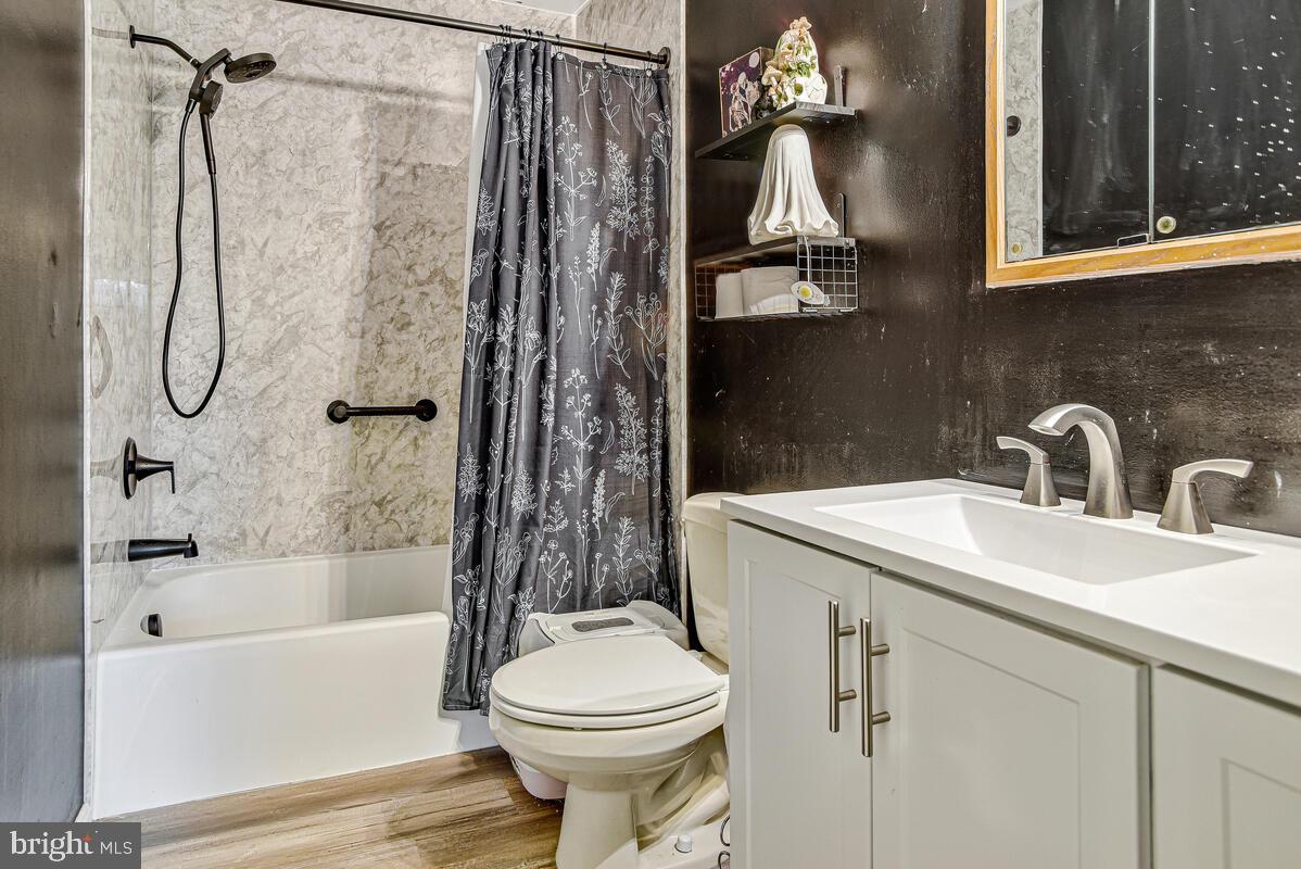 5850 Fire Tower Road Welcome, MD 20693 - Photo 11 of 23 a bathroom with a sink toilet and shower