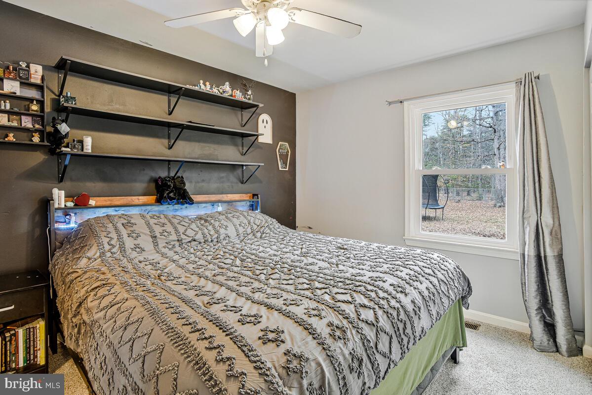 5850 Fire Tower Road Welcome, MD 20693 - Photo 12 of 23 a bedroom with a bed and a window