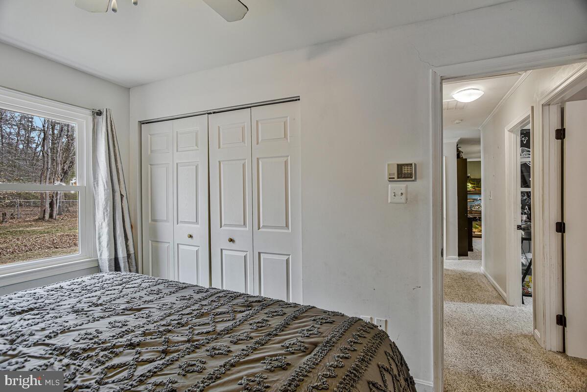5850 Fire Tower Road Welcome, MD 20693 - Photo 13 of 23 a bedroom with a bed and a window