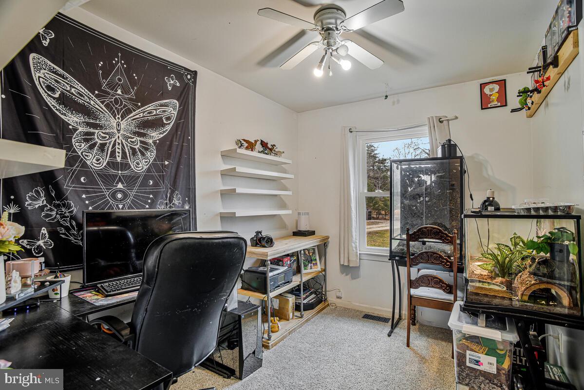 5850 Fire Tower Road Welcome, MD 20693 - Photo 15 of 23 a view of a workspace with furniture and a window