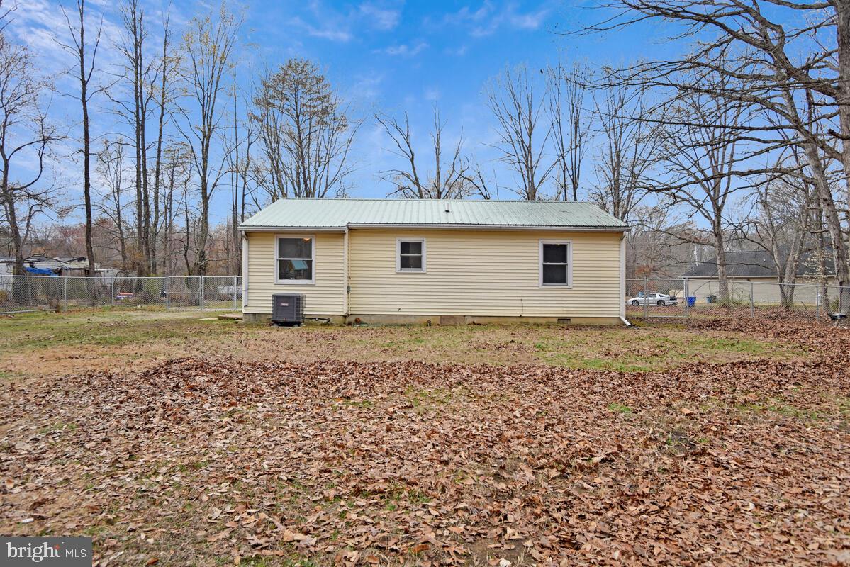 5850 Fire Tower Road Welcome, MD 20693 - Photo 17 of 23 a view of a white house with a yard