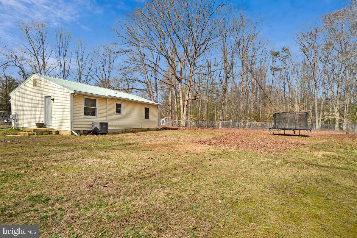 5850 Fire Tower Road Welcome, MD 20693 - Photo 20 of 23 a view of a house with backyard and tree