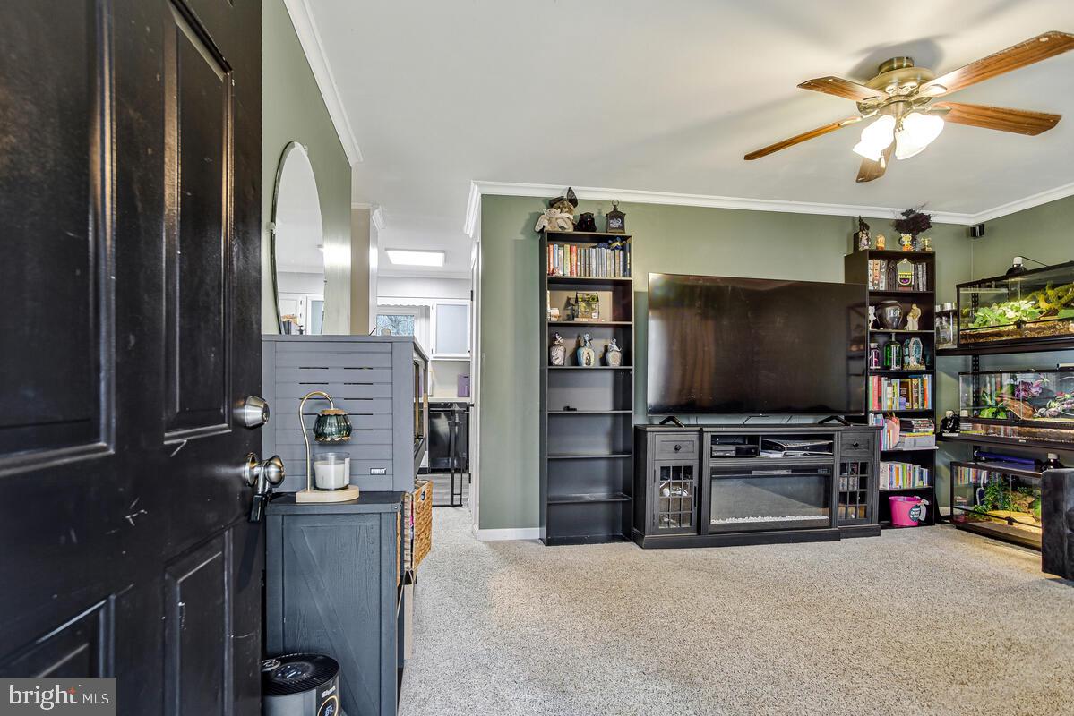 5850 Fire Tower Road Welcome, MD 20693 - Photo 3 of 23 a room with furniture and a flat screen tv