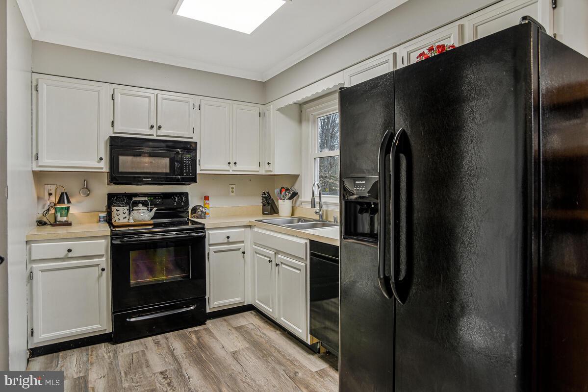 5850 Fire Tower Road Welcome, MD 20693 - Photo 8 of 23 a kitchen with a refrigerator stove and microwave