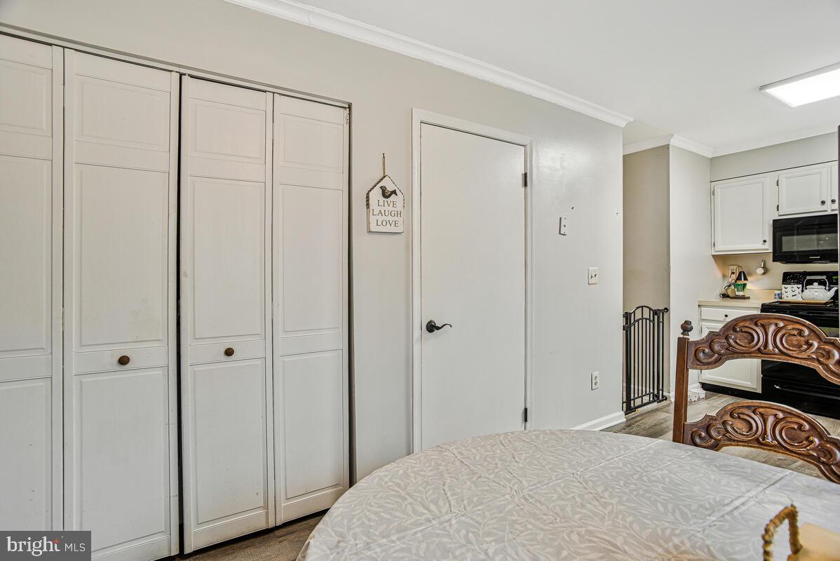 5850 Fire Tower Road Welcome, MD 20693 - Photo 10 of 23 a bedroom with a bed and a flat tv screen