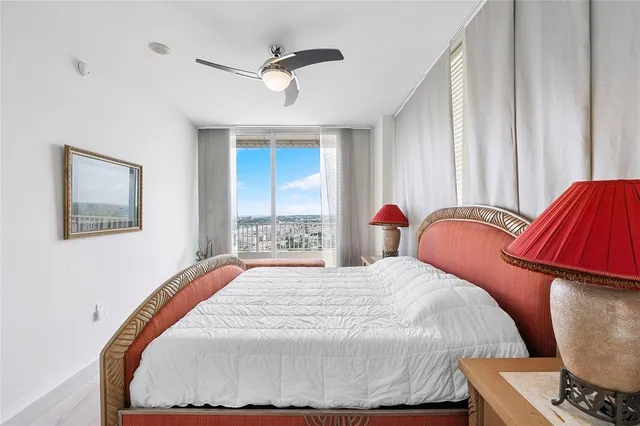 a bedroom with a bed and dresser