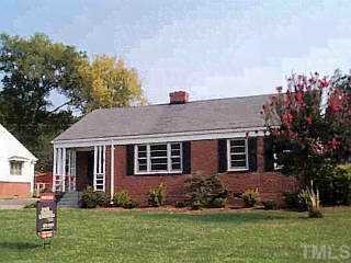 1925 Fairfield Drive Raleigh, NC 27608 - Photo 1 of 1 a front view of a house with a yard and potted plants