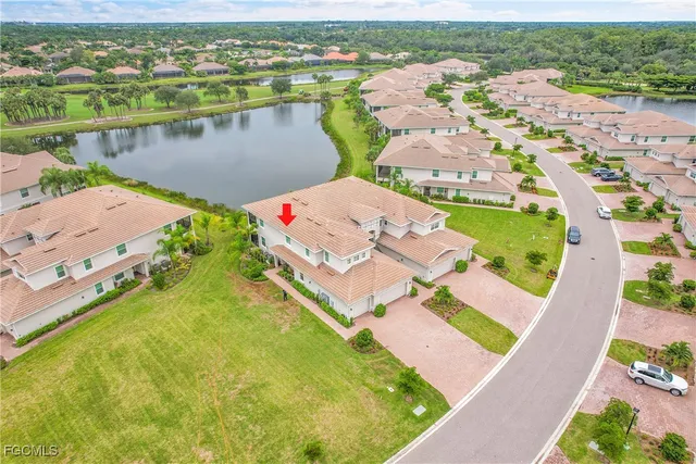 an aerial view of a house with a lake view