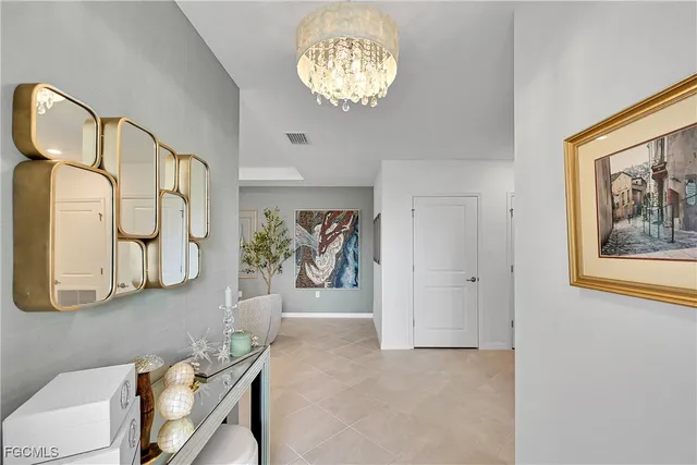 a view of a livingroom with furniture and a chandelier
