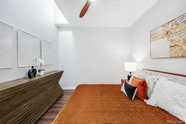 a bed room with a bed and a lamp