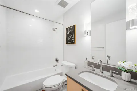 a bathroom with a sink toilet and a bathtub
